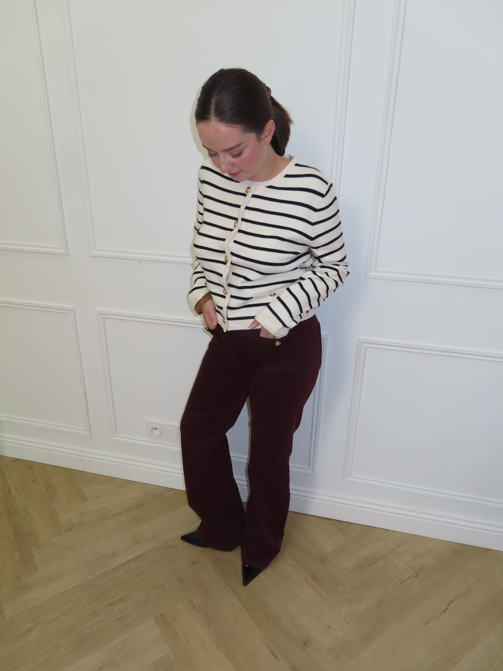 Veste en maille rayée à boutons dorés